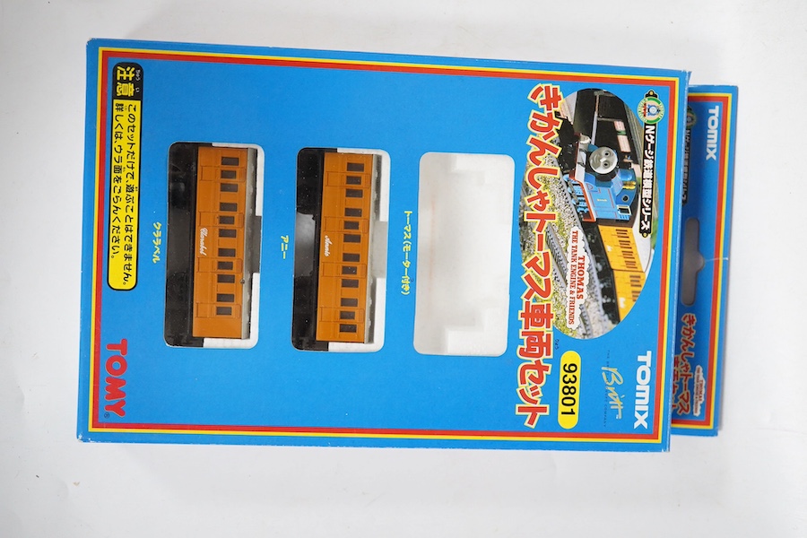 Four boxed Tomix (by Tomy) N gauge railway Thomas the Tank Engine & Friends train packs, comprising of three locomotives and rolling stock (one locomotive missing): James (93802), Henry (93805), Percy (93808) and Thomas